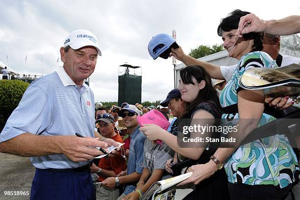 Nick Price signs autographs for fans during the second round of the Outback Steakhouse Pro-Am at TPC Tampa Bay on April 17, 2010 in Lutz, Florida.