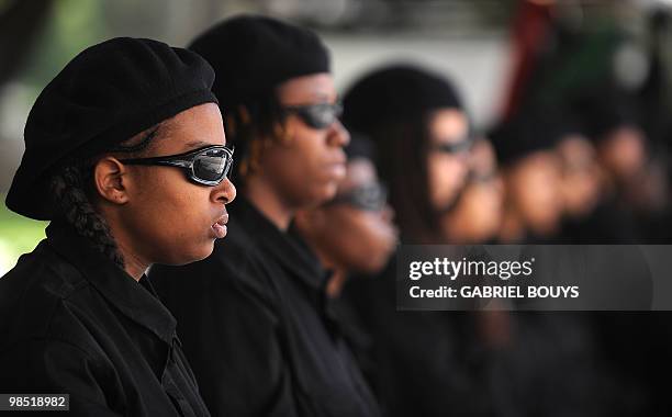 Members of the New Black Panthers group, prepare to attend a demonstration of counterprotesters after the neo-nazi group, The American National...