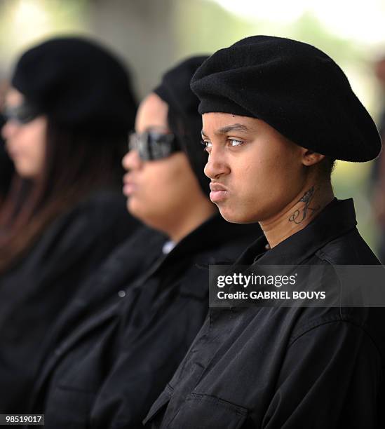 Members of the New Black Panthers group, prepare to attend a demonstration of counterprotesters after the neo-nazi group, The American National...