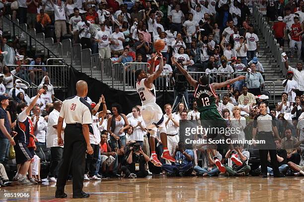 Joe Johnson of the Atlanta Hawks shoots against Luc Richard Mbah a Moute of the Milwaukee Bucks in Game One of the Eastern Conference Quarterfinals...
