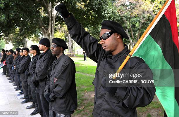 Members of the New Black Panthers group, prepare to attend a demonstration of counterprotesters after the neo-nazi group, The American National...