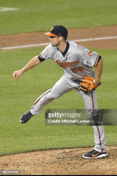 Darren O'Day of the Baltimore Orioles pitches during a baseball game against the Washington Nationals at Nationals Park on June 20, 2018 in...