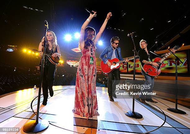 Musicians Cheyenne Kimball, Rachel Reinert, Tom Gossin, and Mike Gossin of the band Gloriana perform onstage during the 45th annual Academy of...