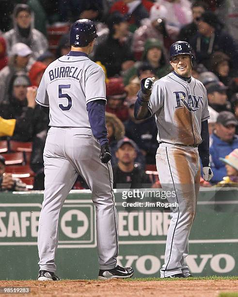 Pat Burrell of the Tampa Bay Rays celebrates with Evan Longoria after hitting a home run in extra innings against the Boston Red Sox at Fenway Park...