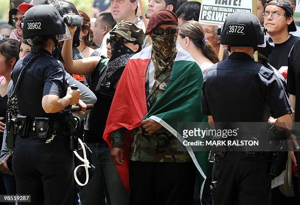 Counterprotesters stand behind a LAPD police line as members of the neo-nazi group, The American National Socialist Movement hold a rally in front of...