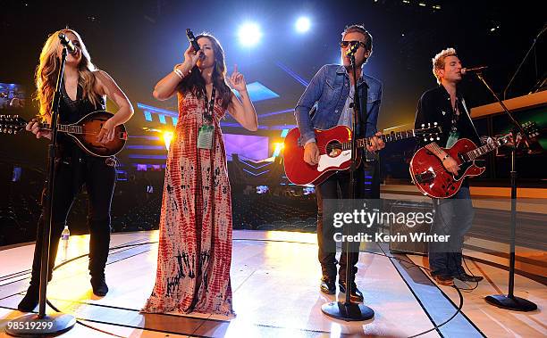 Musicians Cheyenne Kimball, Rachel Reinert, Tom Gossin, and Mike Gossin of the band Gloriana perform onstage during the 45th annual Academy of...