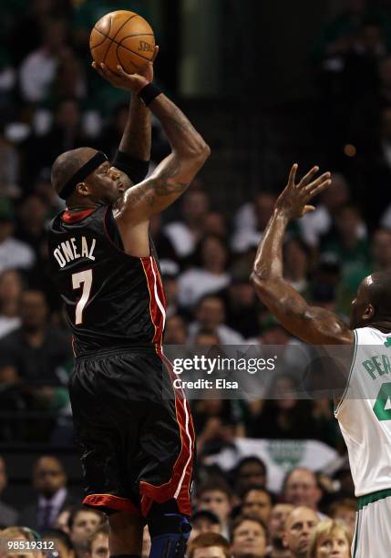 Jermaine O'Neal of the Miami Heat takes a shot as Kendrick Perkins of the Boston Celtics defends during Game One of the Eastern Conference...