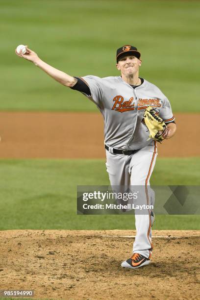 Brad Brach of the Baltimore Orioles pitches during a baseball game against the Washington Nationals at Nationals Park on June 20, 2018 in Washington,...