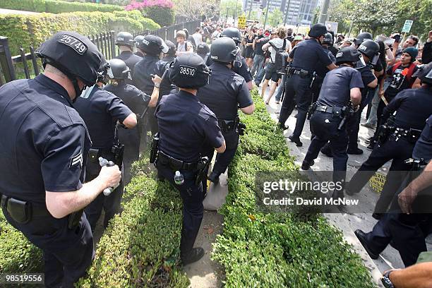 Police break up rock-throwing anti-neo-Nazi demonstrators after a National Socialist Movement rally near City Hall on April 17, 2010 in Los Angeles,...
