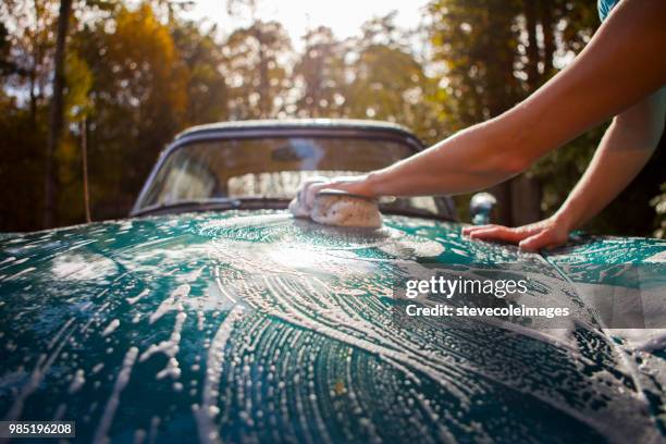 washing car. - vintage car stock pictures, royalty-free photos & images