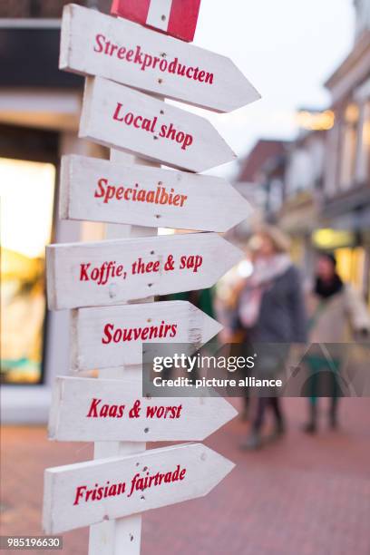 Signposts point to a.o. Souvenirs, cheese, sausage and Frisian fairtrade products in Leeuwarden, Netherlands, 26 January 2018. Leeuwarden in the...