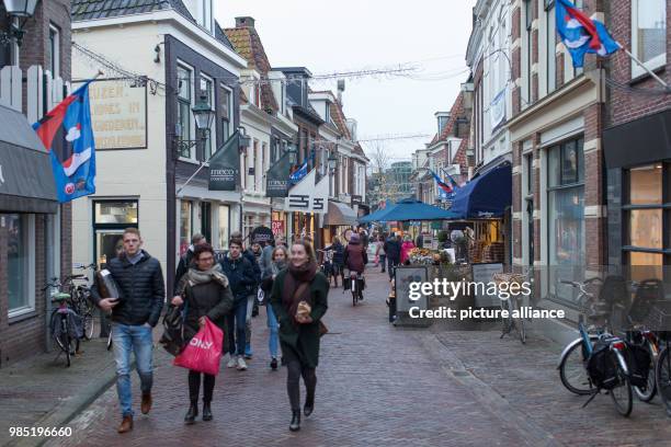 Passerbys walk in a shopping street in Leeuwarden, Netherlands, 26 January 2018. Leeuwarden in the Frisian province is the Capital of Culture 2018....