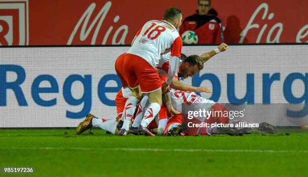 Dpatop - Regensburg's team celebrates the 3-2 goal during the German 2nd division Bundesliga soccer match between Jahn Regensburg and FC Ingolstadt...