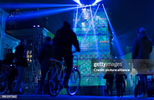 Passerbys stand in front of a light installation in Leeuwarden, Netherlands, 26 January 2018. Leeuwarden in the Frisian province is the Capital of...