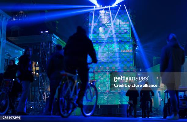 Dpatop - Passerbys stand in front of a light installation in Leeuwarden, Netherlands, 26 January 2018. Leeuwarden in the Frisian province is the...