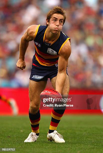 Richard Douglas of the Crows handballs during the round four AFL match between the Adelaide Crows and the Carlton Blues at AAMI Stadium on April 17,...