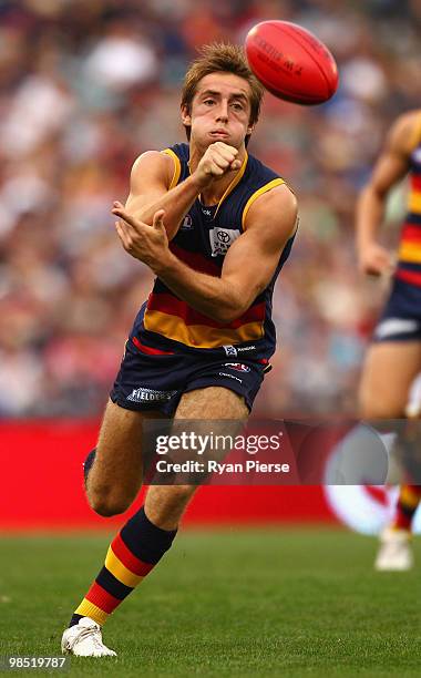 Richard Douglas of the Crows handballs during the round four AFL match between the Adelaide Crows and the Carlton Blues at AAMI Stadium on April 17,...