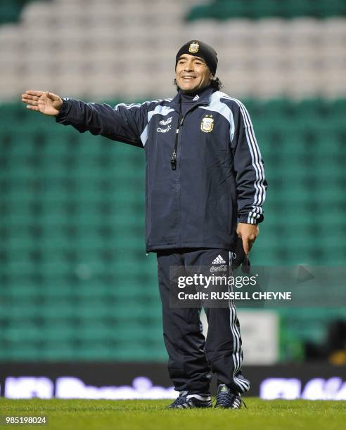 New Argentina coach Diego Maradona gestures as he takes part to a training session with his team on November 17, 2008 in Glasgow on the eve of their...