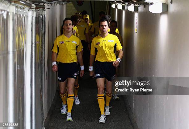 Umpires Jacob Mollison and Stuart Wenn walk down the tunnel before the round four AFL match between the Adelaide Crows and the Carlton Blues at AAMI...