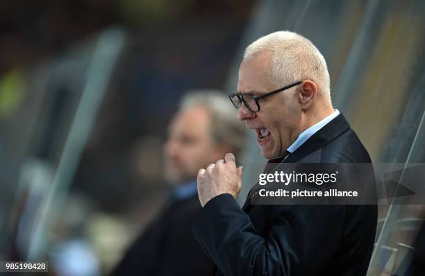 Cologne's head coach Peter Draisaitl gestures during the DEL match between EHC Red Bull Muenchen and Cologne Sharks at the Olympia Eishalle in...