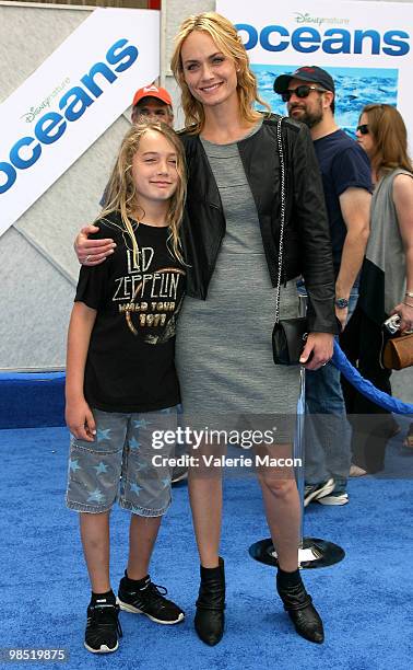 Actress Amber Valletta and son Auden McCaw arrives at the Premiere Of Disneynature's "Oceans" on April 17, 2010 in Hollywood, California.