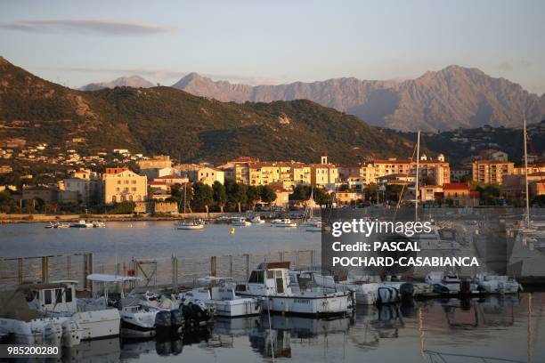 The harbour of L'Ile-Rousse on the French Mediterranean island of Corsica, is pictured at sunset on June 26, 2018.