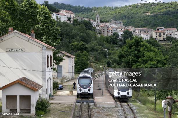 Two trains are seen at the Venaco train Station on June 25, 2018 on the French Mediterranean island of Corsica. - Since January 2012, the Corsica...