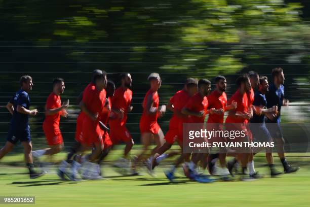 French L1 Nîmes football club's players take part in a training session along with their head coach Bernard Blaquart at the Bastide stadium in Nîmes,...