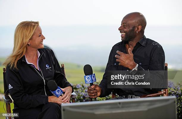 Tournament host Jerry Rice talks to Stephanie Sparks on the Golf Channel during the third round of the Fresh Express Classic at TPC Stonebrae on...