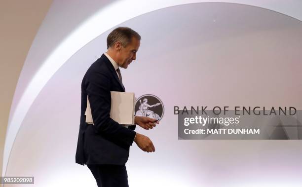 Bank of England Governor Mark Carney attends the Bank of England's financial stability report at the Bank of England in central London on June 27,...