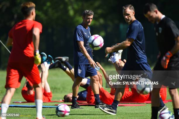 French L1 Nimes football club's French head coach Bernard Blaquart looks on during a training session at the Bastide stadium in Nîmes, southern...