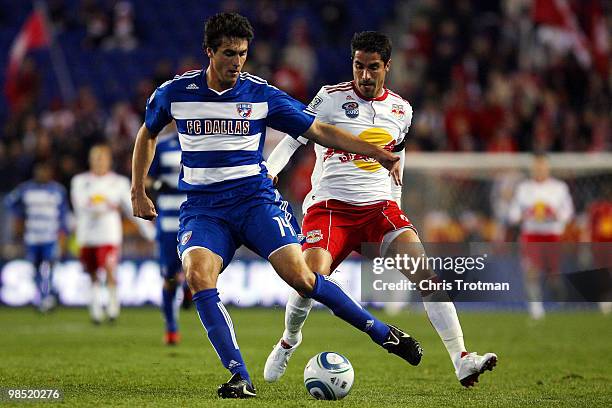 Juan Pablo Angel of the New York Red Bulls battles for the ball against George John of the FC Dallas during the match at Red Bull Arena on April 17,...