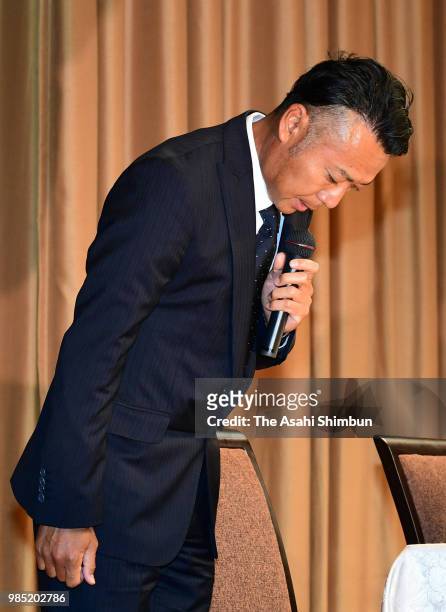 Professional golfer Shingo Katayama bows for apology during a press conference on June 27, 2018 in Tokyo, Japan. A male guest was part of golfer...