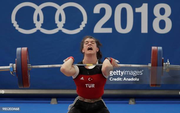 Turkish weightlifter Rabia Kaya competes in the 75kg Women's weightlifting final within the XVIII Mediterranean Games Tarragona on June 27, 2018 in...
