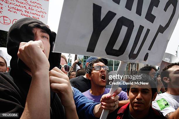Anti-neo-Nazi demonstrators protest during a National Socialist Movement rally near City Hall on April 17, 2010 in Los Angeles, California. An NSM...