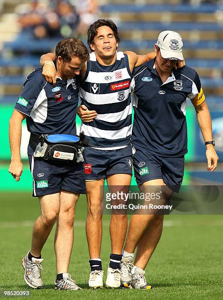Matthew Stokes of Geelong is carried from the ground after injuring his ankle during the round two VFL match between Geelong and Box Hill at Skilled...