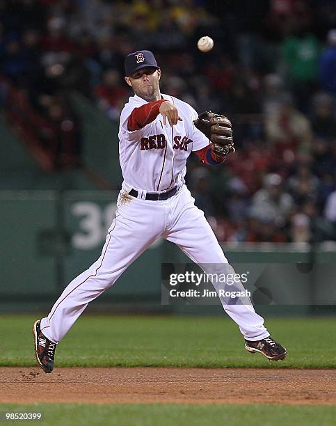 Dustin Pedroia the Boston Red Sox maes an assist against the Tampa Bay Rays at Fenway Park on April 17, 2010 in Boston, Massachusetts.