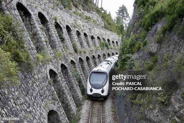 Train travels between cliffs in Vivario on June 25, 2018 on the French Mediterranebeetwen an island of Corsica. - The Eiffel bridge, built by Gustave...