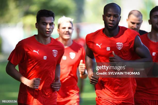 French L1 Nîmes football club's newly recruited french defender Florian Miguel and French L1 Nîmes football club's newly recruited french defender...