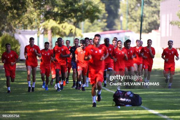 French L1 Nîmes football club's players take part in a training session with teammates on June 27, 2018 at the Bastide stadium in Nîmes, southern...