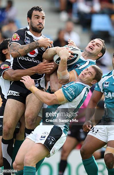 Michael Gordon of the Panthers takes possession from Wade McKinnon of the Warriors to score a try during the round six NRL match between the Warriors...