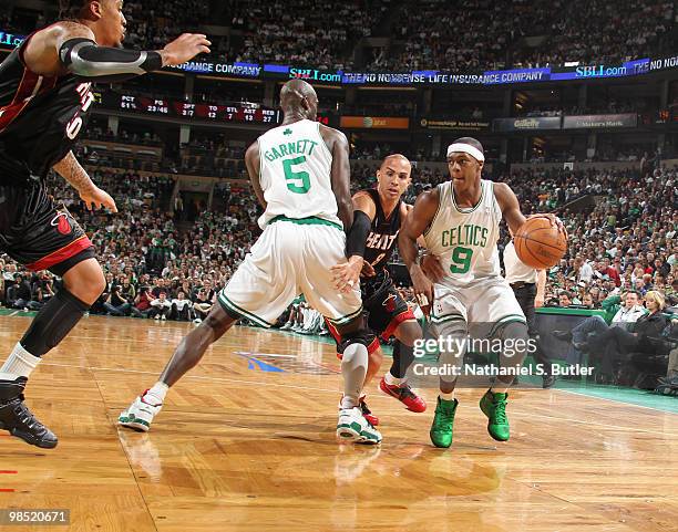 Rajon Rondo of the Boston Celtics drives past Carlos Arroyo of the Miami Heat in Game One of the Eastern Conference Quarterfinals during the 2010 NBA...