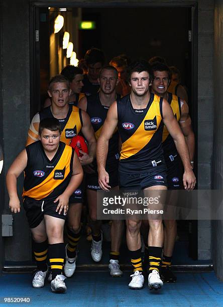 Trent Cotchin of the Tigers leads his team out before the round four AFL match between the Richmond Tigers and the Melbourne Demons at the Melbourne...