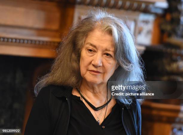 June 2018, Germany, Hamburg: The entry of the pianist Martha Argerich standing in the town hall of Hamburg after signing the golden book of the city....