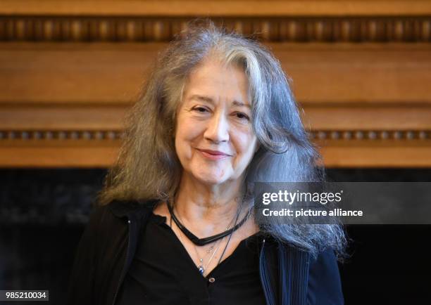 June 2018, Germany, Hamburg: The entry of the pianist Martha Argerich standing in the town hall of Hamburg after signing the golden book of the city....