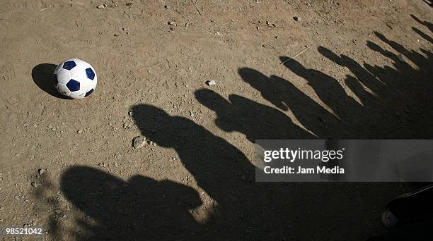 Detail of ball and shadows of fans during a training session of Mexico's nacional soccer team at La Capilla Field on April 17, 2010 in Avandaro,...