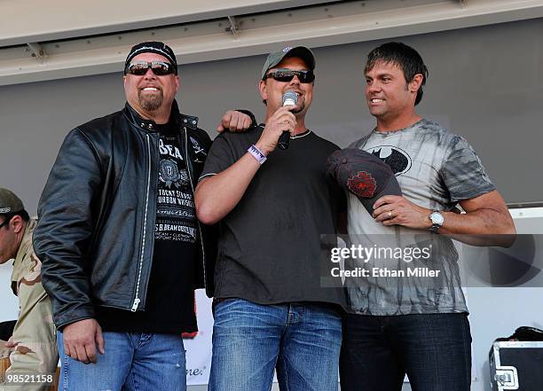 Singers Eddie Montgomery and Troy Gentry of the duo Montgomery Gentry speak onstage with host Storme Warren onstage during the Academy Of Country...
