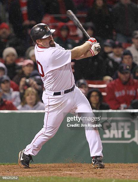 Kevin Youkilis of the Boston Red Sox hits a home run against the Tampa Bay Rays at Fenway Park on April 17, 2010 in Boston, Massachusetts.