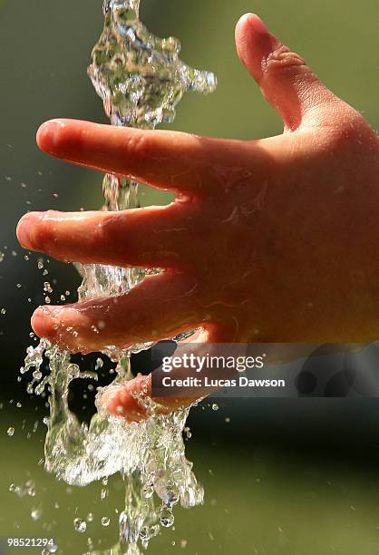 Girls plays with the water during the Dow Live Earth Run for water at The Docklands on April 18, 2010 in Melbourne, Australia.