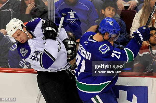 Ryan Smyth of the Los Angeles Kings reacts after getting hit by Mason Raymond of the Vancouver Canucks during the second period in Game Two of the...
